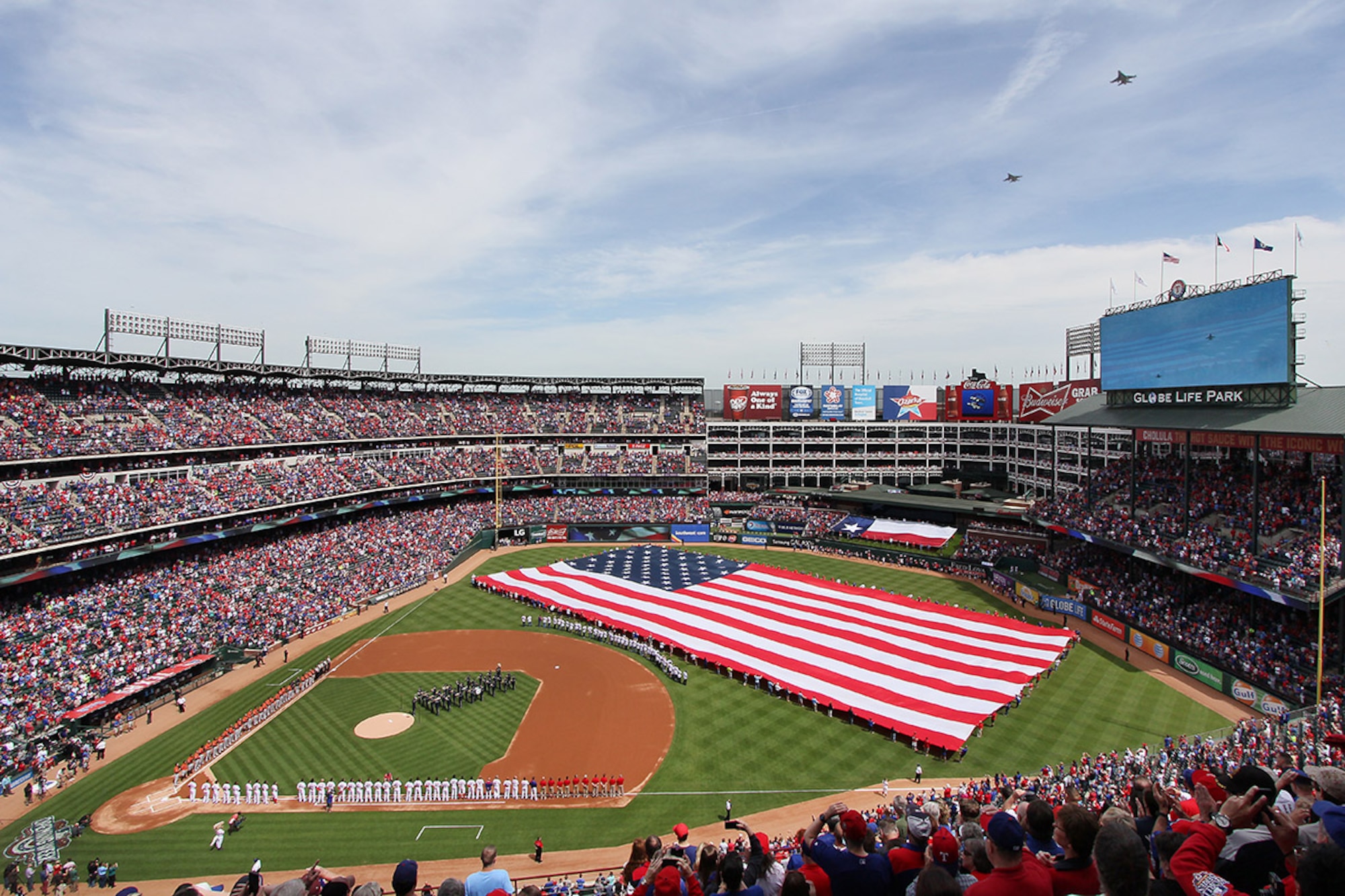Two F-16s from the 457th Fighter Squadron, 301st Fighter Wing, performed a flyover April 10 during the Texas Rangers' Opening Day at Globe Life Park in Arlington, Texas. (Courtesy photo)