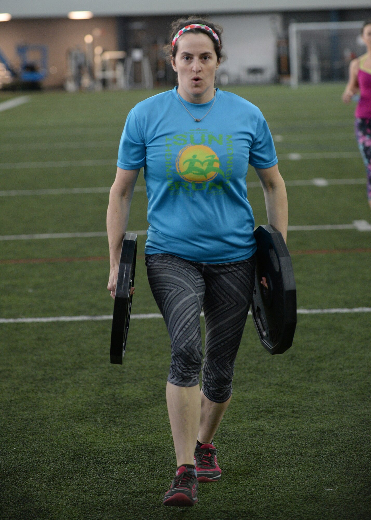 Lynne Peterson, a University of Alaska Anchorage nursing student, completes the kettle bell walk during the “Tough Enough” competition April 24, 2015, at the Baker Field House on Eielson Air Force Base, Alaska. The “Tough Enough” competition was a series of strength-based exercises to promote sexual assault awareness and prevention while introducing knowledge on the subject. (U.S. Air Force photo by Staff Sgt. Shawn Nickel/Released)