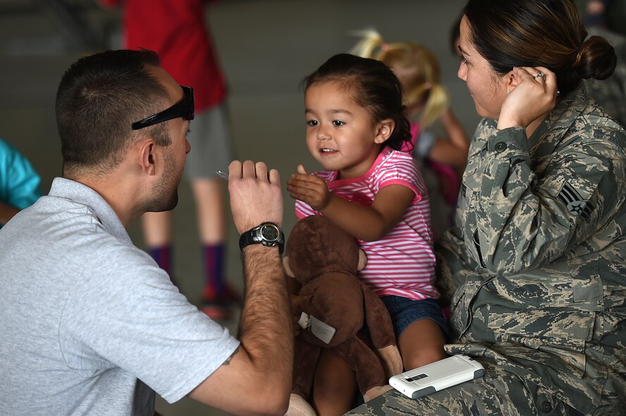 Creech Airmen and their families took part in the 2015 “Take Your Kid to Work Day” event April 23, 2015 as part of the Department of Defense observance of Month of the Military Child. During the day's events the Creech Airmen and various base and local organizations provided a plethora of events including demonstrations from the local fire department, work center tours, a professional magician, and a DJ. (U.S. Air Force photo by Tech Sgt. Nadine Barclay/Released)