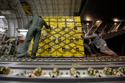 U.S. Air Force personnel load eight pallets of equipment onto a USAF C-17 Globemaster III from Joint Base Charleston, S.C., at March Air Reserve Base, Calif., April 26, 2015. The equipment is for the Urban Search and Rescue Task Force 2, or CA-TF2. When called upon, these teams travel with specialized equipment, such as heavy concrete cutting equipment, chainsaws, search cameras and sonar to locate victims, as well as specialized communications and generators.  In addition to the pallets there were 57 members of the CA-TF2 as well as six search dogs. To keep the aircraft moving, the mission will be flown by three different aircrews, two from the 437th Airlift Wing at JB Charleston and one from the 164th Airlift Wing at the Tennessee Air National Guard in Memphis, TN.  (U.S. Air Force photo by Airman 1st Class Taylor Queen/Released) 