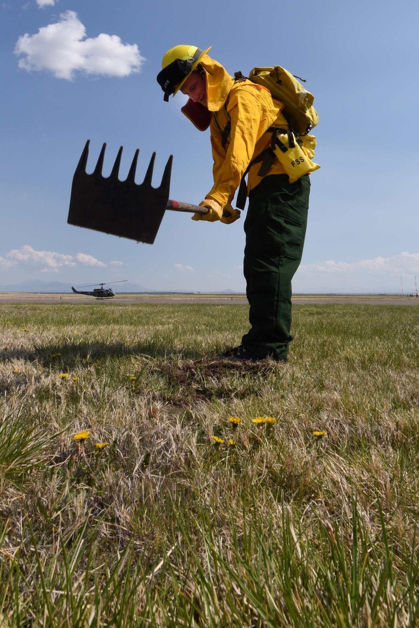 Airman 1st Class Tyler Morgan, 341st Civil Engineer Squadron firefighter, practices a fireline for wildland fire fighting April 22, 2015, at Malmstrom Air Force Base, Mont. Malmstrom firefigters also respond to wildland fires alongside local fire departments, following Mutual Aid requests. (U.S.  Air Force photo/Chris Willis)