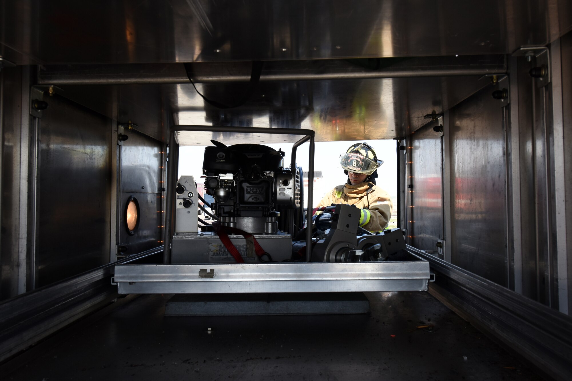 Senior Airman Hector Guemarezcolon, 341st Civil Engineer Squadron firefighter, prepares to accomplish morning checkout on rescue-truck equipment April 22, 2015, at Malmstrom Air Force Base, Mont. Crews at the Malmstrom Fire Department operate on 24-hour shifts and must be in full gear and out the door within 60 seconds from the moment an alarm sounds. (U.S. Air Force photo/Chris Willis)