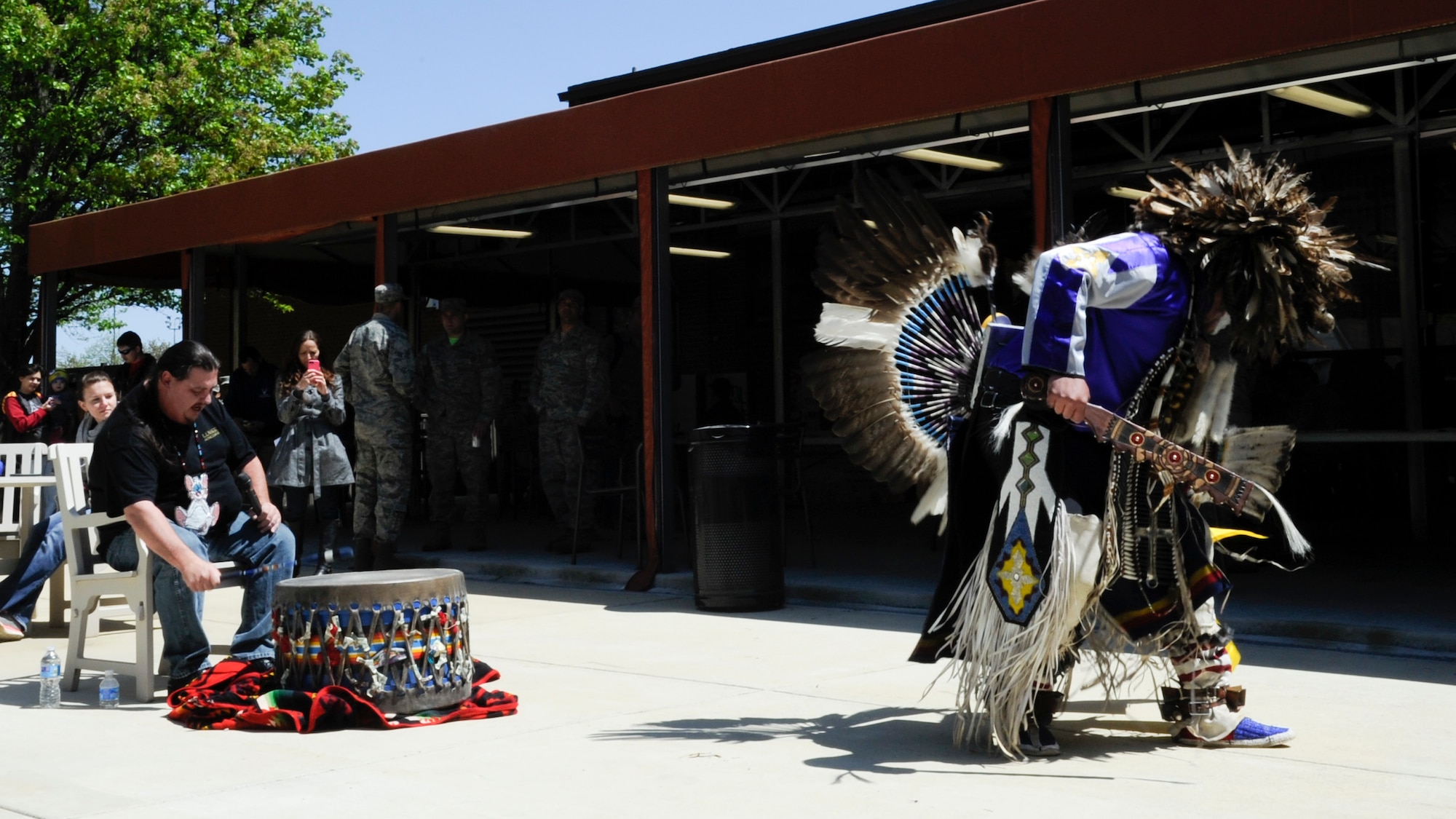 Charles Eagle Tail, Mi’kmaq tribe member, performs a men’s Northern Traditional dance at the National Capital Region Round Up at the Community Commons on Joint Base Andrews, Md., April 24, 2015. The event brought service members and families together through shared interests and provided more than 200 sign-up sheets for different hobbies, events and groups. (U.S. Air Force photo by Senior Airman Mariah Haddenham/Released)