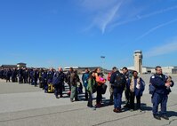 Sixty-nine members of the Fairfax County Urban Search and Rescue Team, Fairfax, Va., prepare to board an Air Force C-17 Globemaster III at Dover Air Force Base, Del., April 26, 2015. Members of the team are specially trained career and volunteer fire and rescue personnel, with expertise in rescuing victims from collapsed structures following a natural or man-made catastrophic event. The team is deploying to Nepal to assist with rescue operations after the country was struck by a 7.8-magnitude earthquake. (U.S. Air Force photo/Airman 1st Class William Johnson)