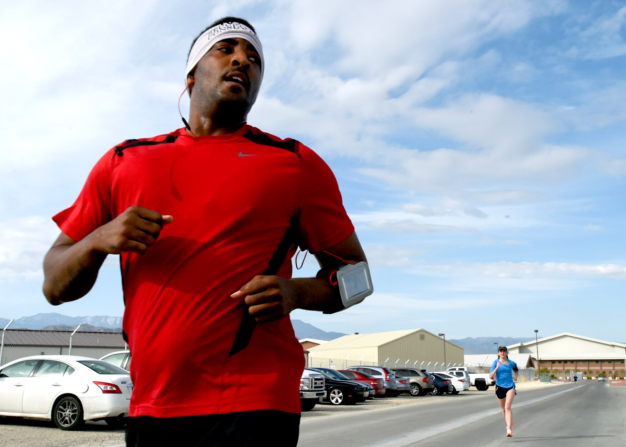 Runners sprint to the finish line during a 5K run April 24, 2015, at Creech Air Force Base, Nevada. The Sexual Assault Prevention & Response Office, Family Advocacy, and ADAPT offices sponsored the 5K run for several observances held in April. (U.S. Air Force photo by Tech. Sgt. Shad Eidson /Released) 