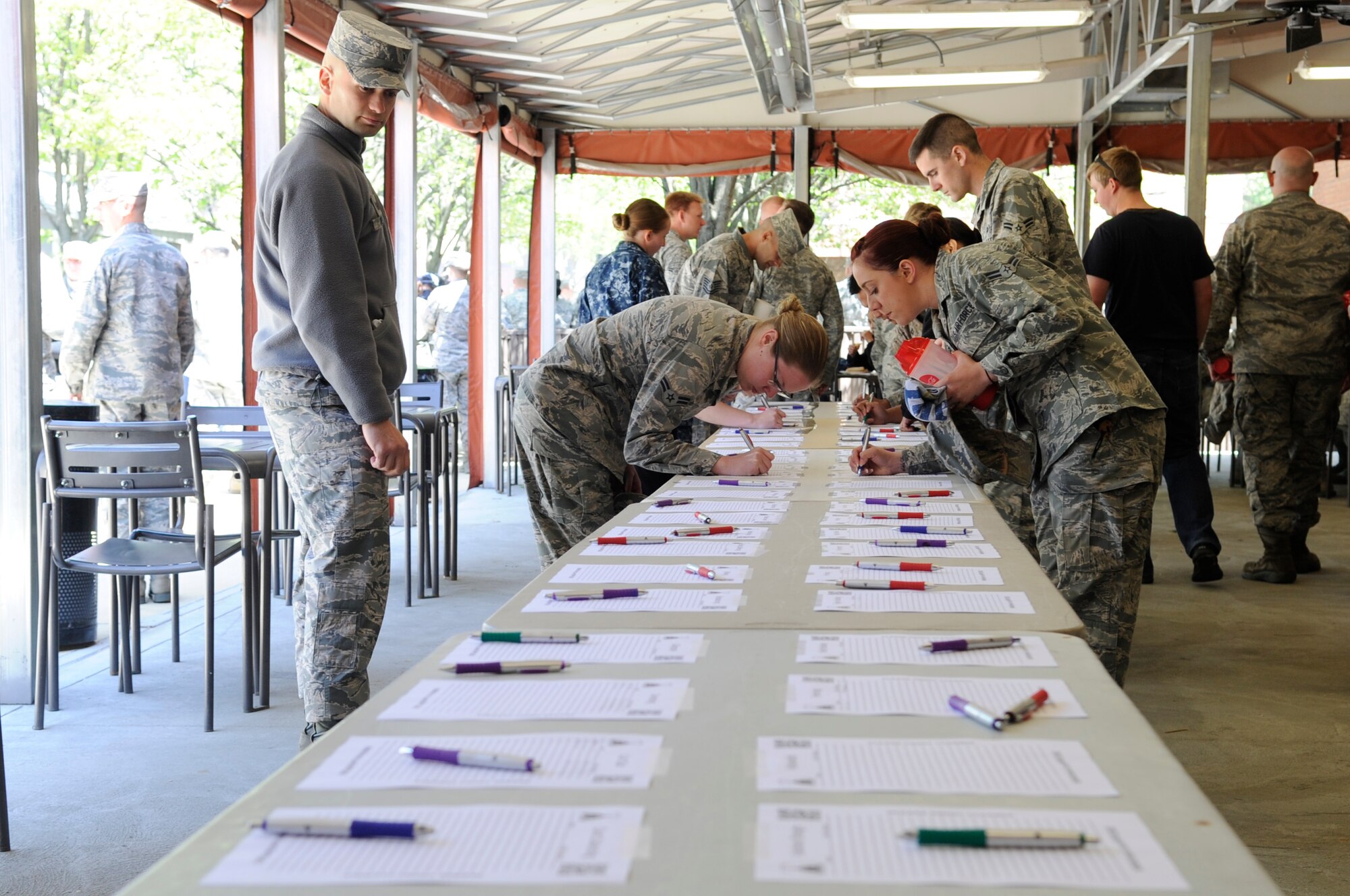Members of Joint Base Andrews, Md., and the National Capital Region join together to sign up for events and clubs at the Community Commons here for the NCR Round Up, April 24, 2015. The event brought service members and families together through shared interests and provided more than 200 sign-up sheets for different hobbies, events and groups. (U.S. Air Force photo by Senior Airman Mariah Haddenham/Released)