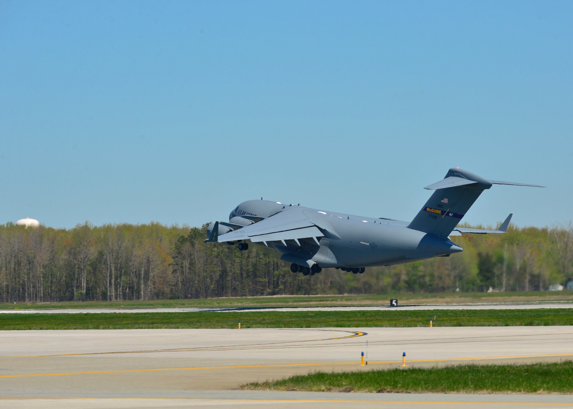 A U.S. Air Force C-17 Globemaster III takes off from Dover Air Force Base, Del., April 26, 2015. The aircraft is loaded with 69 members of the Fairfax County Urban Search and Rescue Team, supplies and equipment, and six K-9s, to assist Nepal with rescue operations after the country was struck by a 7.8-magnitude earthquake. (U.S. Air Force photo/Airman 1st Class William Johnson)