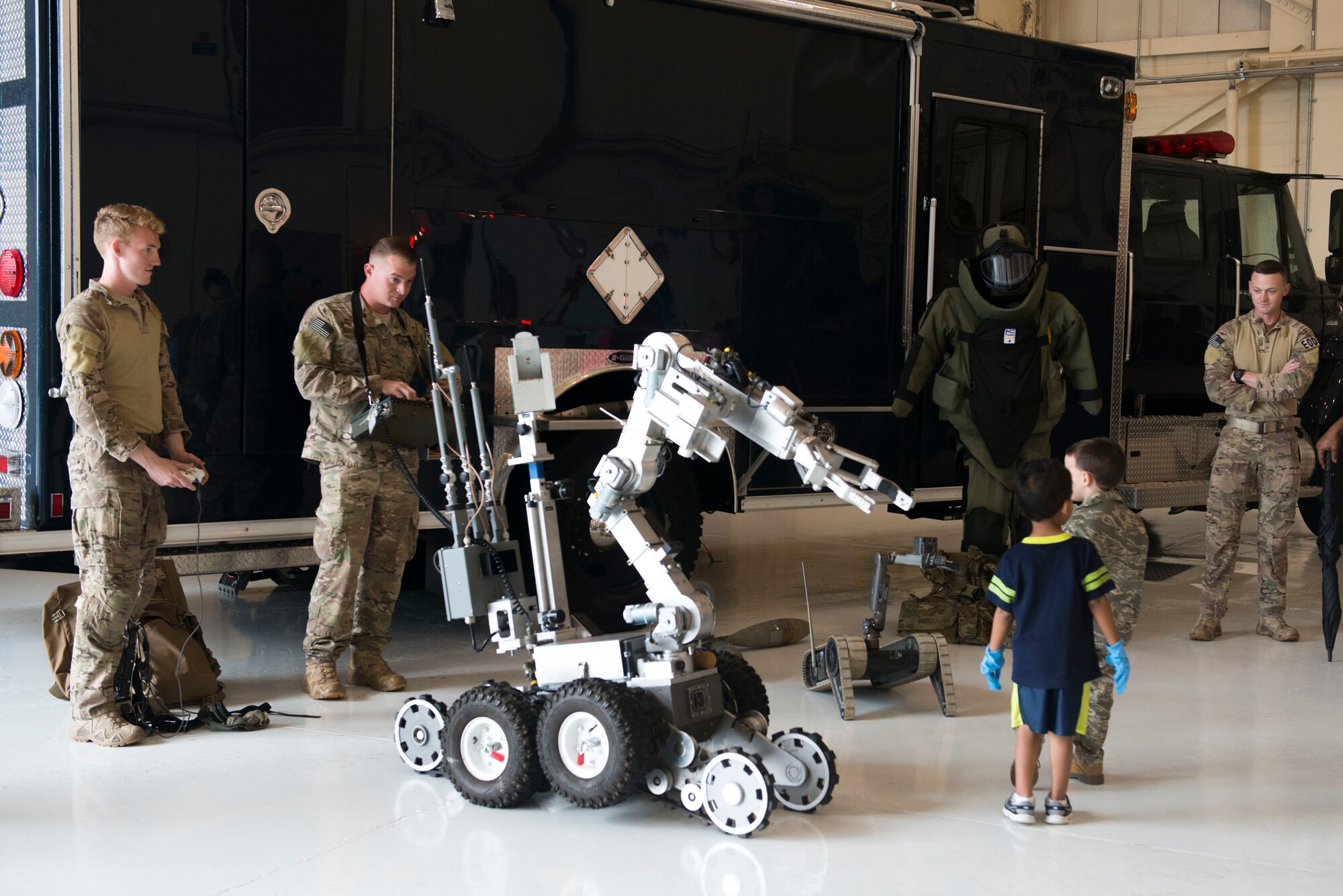 The 23d Civil Engineer Squadron explosive ordnance disposal flight performs a robot demonstration during a Kids Deployment Line April 25, 2015, at Moody Air Force Base, Ga. Military working dog and fire department displays were also available for children to view. (U.S. Air Force photo by Airman 1st Class Dillian Bamman/Released)