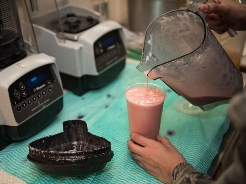 Airman 1st Class Sylvia Ramos, 446th Force Support Squadron services specialist, prepares a fruit smoothie at the Contrails Dining Facility on Beale Air Force Base, April 23.  The Food Transformation Initiative ensures healthy food options are available for customers. (U.S. Air Force photo by Staff Sgt. Brenda Davis)