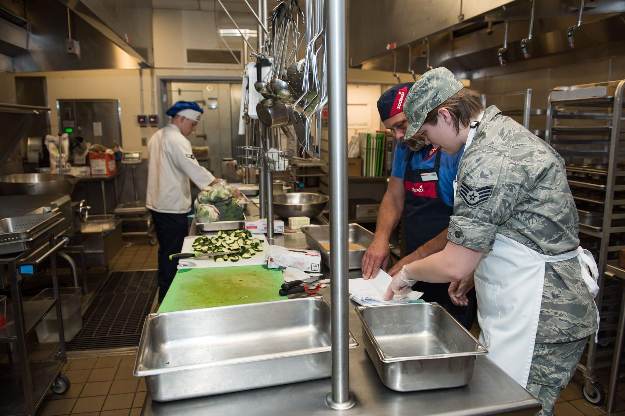 Staff Sgt. Bethany Hiser, 446th Force Support Squadron services specialist, reviews a recipe with Chef Ron before gathering the necessary ingredients at the Contrails Dining Facility on Beale Air Force Base, April 23. The Reservists from Joint Base Lewis-McChord were at Beale for their annual training in various duties including lodging, fitness, recreation and mortuary affairs.
(U.S. Air Force photo by Staff Sgt. Brenda Davis)