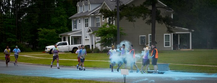 Participants pass through a paint station during the Paint Run 5K Fun Run, April 25, 2015 at Joint Base Charleston – Weapons Station, S.C. This free event was open to everyone and was co-hosted by Joint Base Charleston Sexual Assault Prevention and Response Program. April is sexual assault awareness month. This year’s theme is, “Eliminate Sexual Assault: Know your part. Do your part.” The purpose of sexual assault awareness month is to raise awareness about sexual assault prevention and support sexual assault survivors. (U.S. Air Force photo/Staff Sgt. Ashley Hyatt)