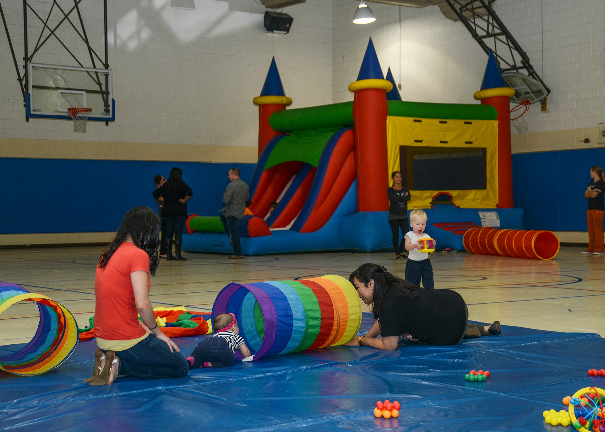 Moms, Pops and Tots received a $1,000 donation from the Edwards AFB Civilian-Military Support Group. The funds will be used to help purchase new equipment and move the program from the Youth Center gym into a permanent location. (U.S. Air Force photo by Rebecca Amber)