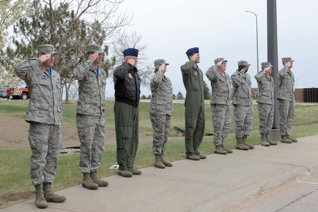 Base leaders salute the flag during a retreat ceremony at Ellsworth Air Force Base, S.D., April 17, 2015. Commanders and chiefs from across the base gathered to participate in the retreat ceremony honoring the 73rd anniversary of the Doolittle Raid while paying respect to the flag. (U.S. Air Force photo by Airman 1st Class Rebecca Imwalle / Released)