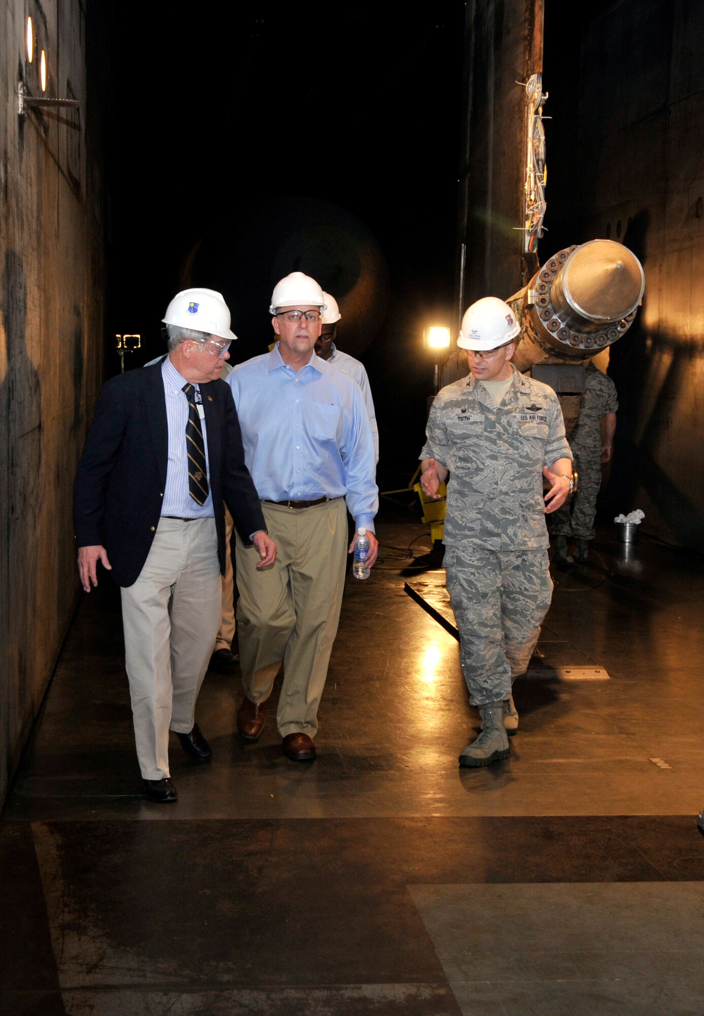 Congressman Scott DesJarlais (second from left) tours the Propulsion Wind Tunnel 16-foot Supersonic Tunnel at AEDC during a visit on April 8. The wind tunnel test aerodynamic flows for flight systems and has a capability of achieving Mach speeds up to 4.75 or approximately 3,000 mph. DesJarlais also visited the von Karman Gas Dynamics Facility, the Arc Heater Facility and the Space Threat Assessment Testbed to see facility capabilities and upgrades. Pictured with DesJarlais, left to right, is AEDC Propulsion Wind Tunnel Test Branch Technical Director Wayne Hawkins, DesJarlais’ staff member Isaiah Robinson and AEDC Commander Col. Raymond Toth. (Photo by Jacqueline Cowan)