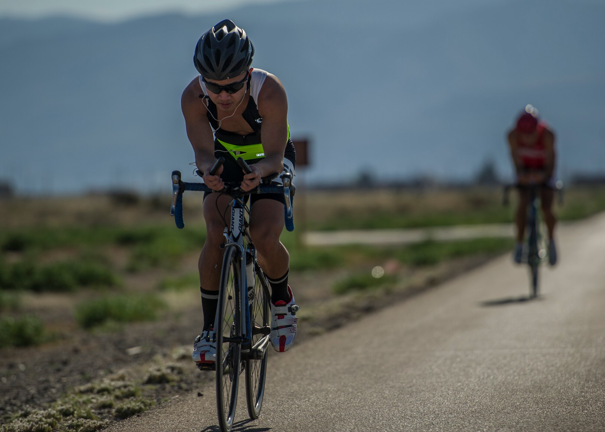 Members of Team Holloman bikes their way around the base perimeter road during the 30k bike ride portion of the Joker Duathlon held at Holloman Air Force Base, N.M., April 25, 2015. The 49th Force Support Squadron and the Domenici Fitness Center hosted a duathlon that consisted of a 5k run, 30k bike ride and ended with an additional 3k run. Participants were allowed to join alone, or they could tackle the duathlon as a team of two. (U.S. Air Force photo by Airman 1st Class Aaron Montoya / Released)