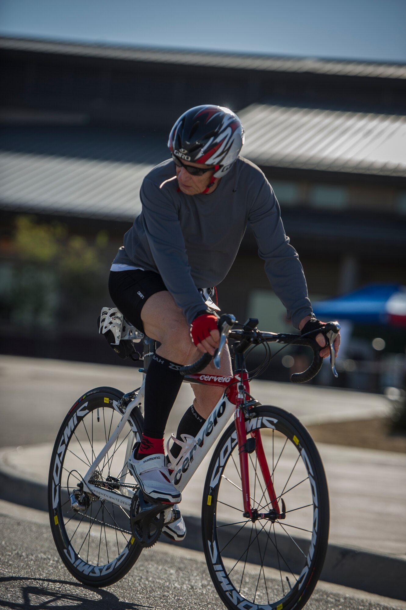 A Joker Duathlon participant embarks on a 30k bike ride after finishing the initial 5k run at Holloman Air Force Base, N.M., April 25, 2015. After completing a 5k run and a 30k bike ride, the participants had to complete another 3k run to finish the marathon. Entrants signed up both as two person teams and by themselves. (U.S. Air Force photo by Airman 1st Class Aaron Montoya / Released)