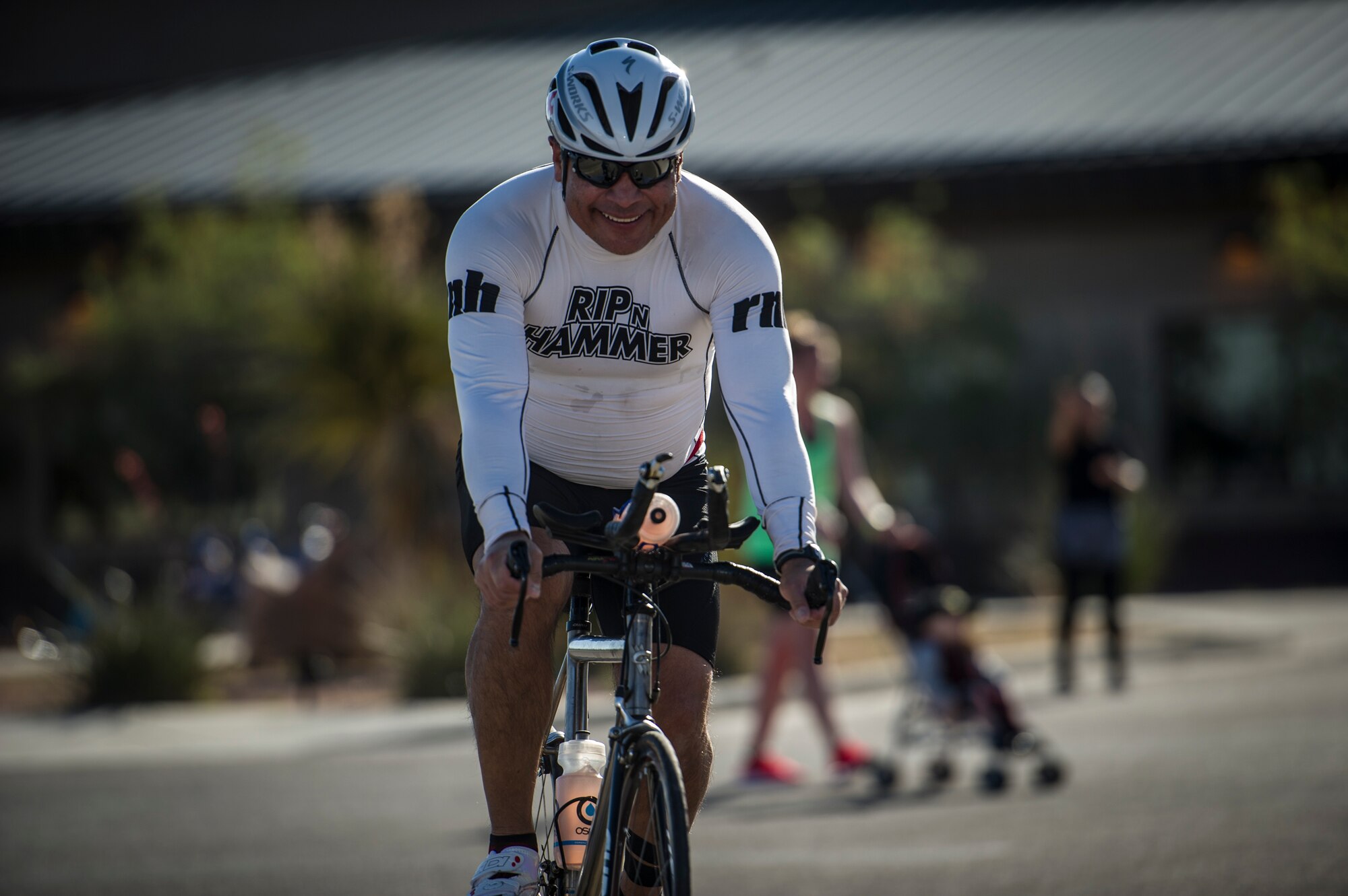 A member of Team Holloman begins the 30k bike ride portion of the Joker Duathlon which was held at Holloman Air Force Base, N.M., April 25, 2015. The participants completed a 5k run before a 30k ride through the high desert around the base perimeter and finished with a final 3k run. Participants entered the duathlon as both single entities and teams of two. (U.S. Air Force photo by Airman 1st Class Aaron Montoya / Released)