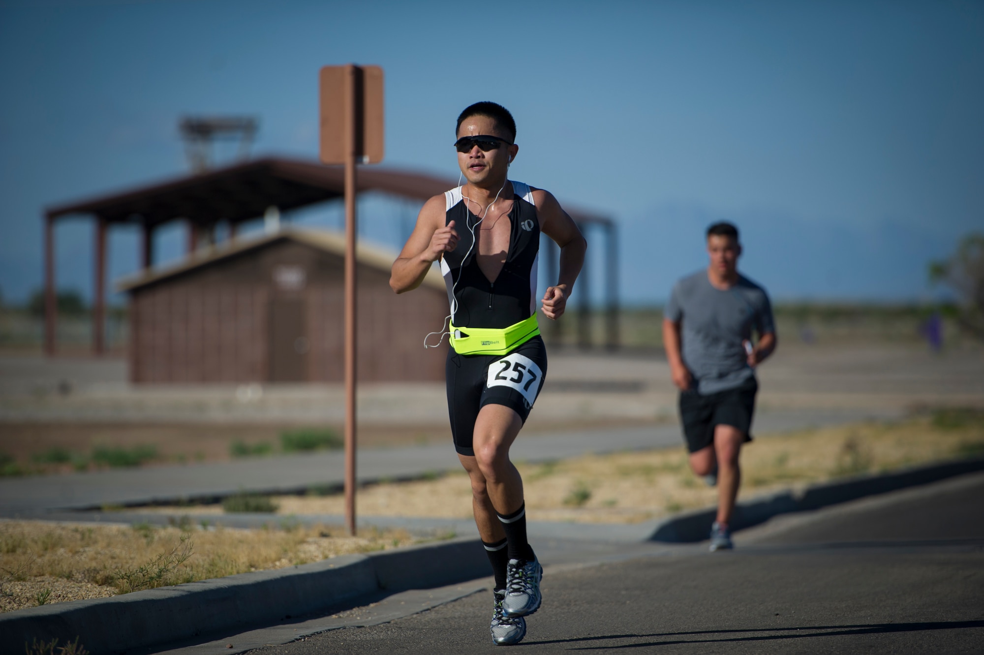 Members of Team Holloman finish the first running portion of the Joker Duathlon held at Holloman Air Force Base, N.M., April 25, 2015. The duathlon challenged participants with two running sections totaling 8k, and an 30k bike ride through the high desert around the base perimeter. The duathlon was open to anyone with proper access to the base and the Domenici Fitness Center. (U.S. Air Force photo by Airman 1st Class Aaron Montoya / Released)