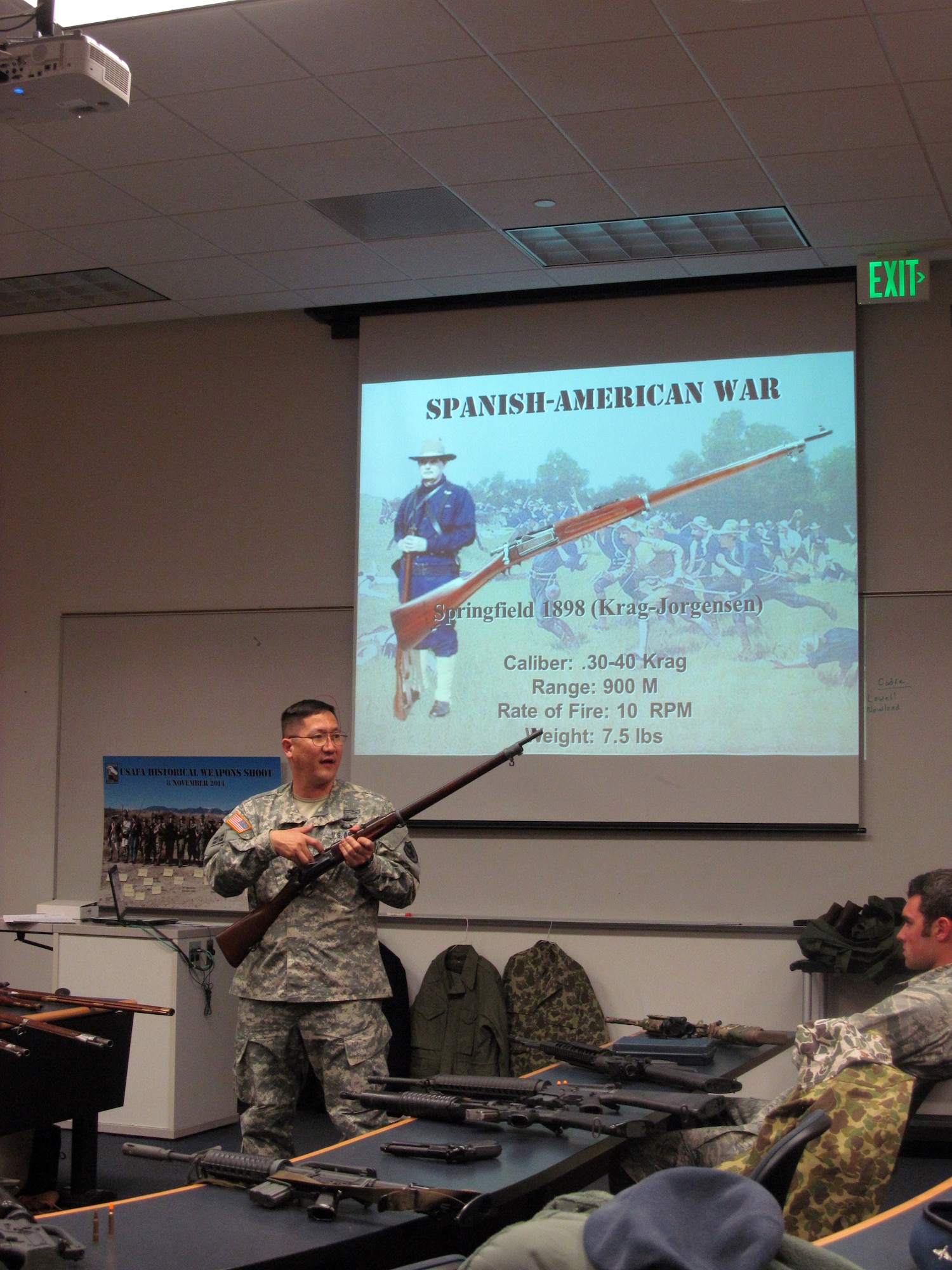 U.S. Army Lt. Col. Nathan Watanabe, a history professor at the Air Force Academy, shows an M1898 Krag-Jorgensen rifle to a class of Academy cadets April 19, 2015, at Fort Carson. The cadets took part in an Academy Historical Weapons Shoot and handled and fired 27 historic military firearms, including the 1766 Charleville Musket, the 5.56mm M16A4 Rifle and the M4 Carbine, to better understand the small arms used by the U.S. military throughout its history. (Lt. Col. Don Langley)
