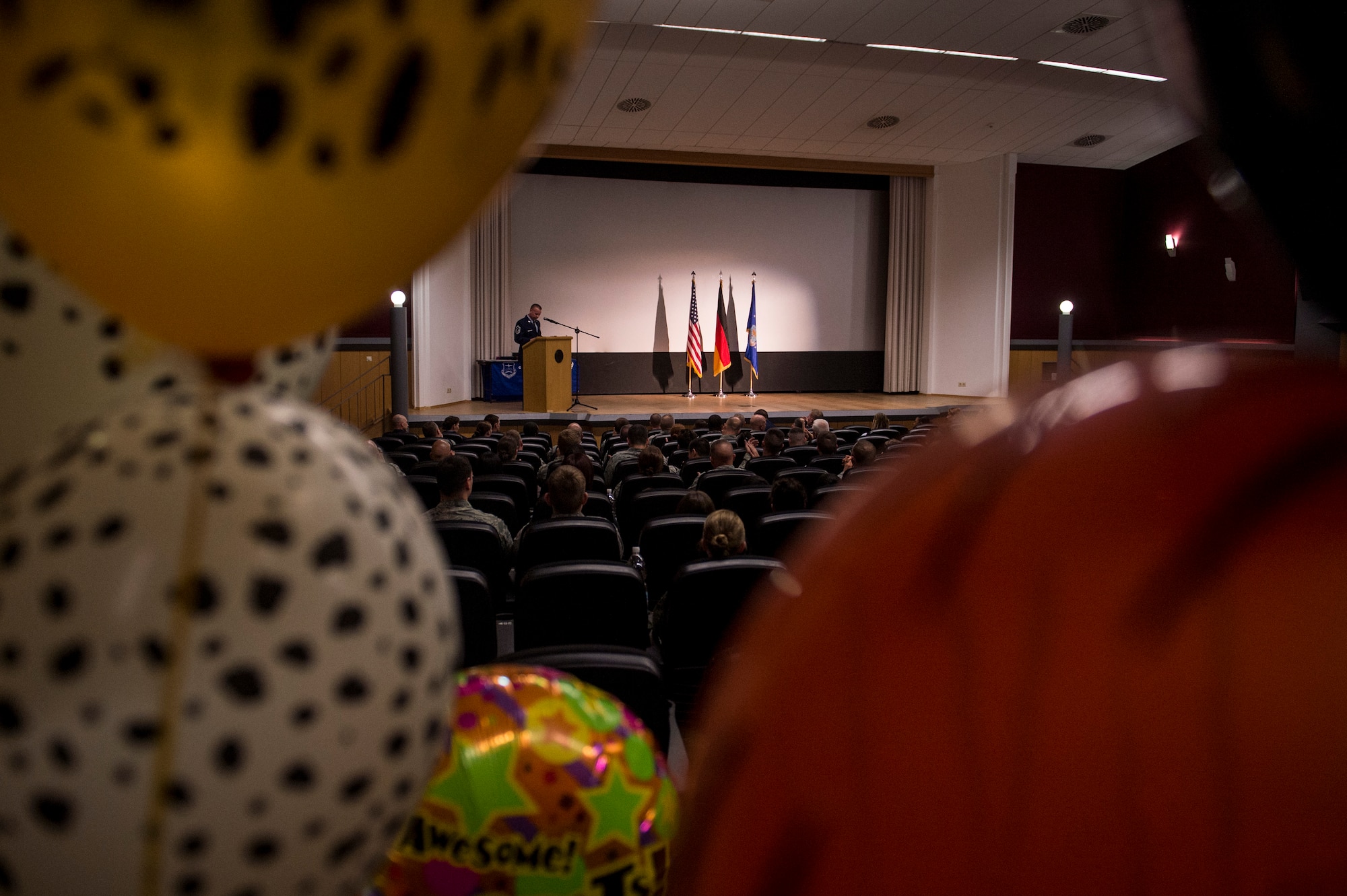 Airmen attend a Community College of the Air Force graduation ceremony at the base theater April 24, 2015, at Spangdahlem Air Base, Germany. A federally chartered college, CCAF partners with more than 108 affiliated Air Force schools, 82 Education Service Offices located worldwide, and more than 1,500 civilian academic institutions to serve approximately 300,000 active, guard, and reserve enlisted personnel. (U.S. Air Force photo by Senior Airman Rusty Frank/Released)