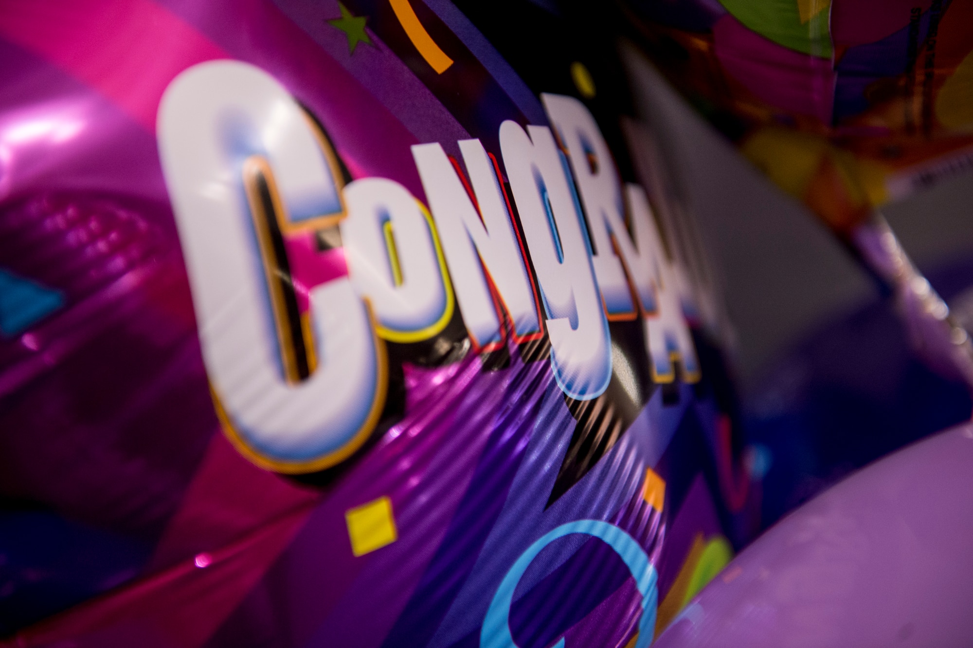 A balloon is displayed inside the base theater during a Community College of the Air Force graduation ceremony April 24, 2015, at Spangdahlem Air Base, Germany. During the ceremony friends, families and wing leadership congratulated more than 40 graduates in attendance on their achievement. (U.S. Air Force photo by Senior Airman Rusty Frank/Released)