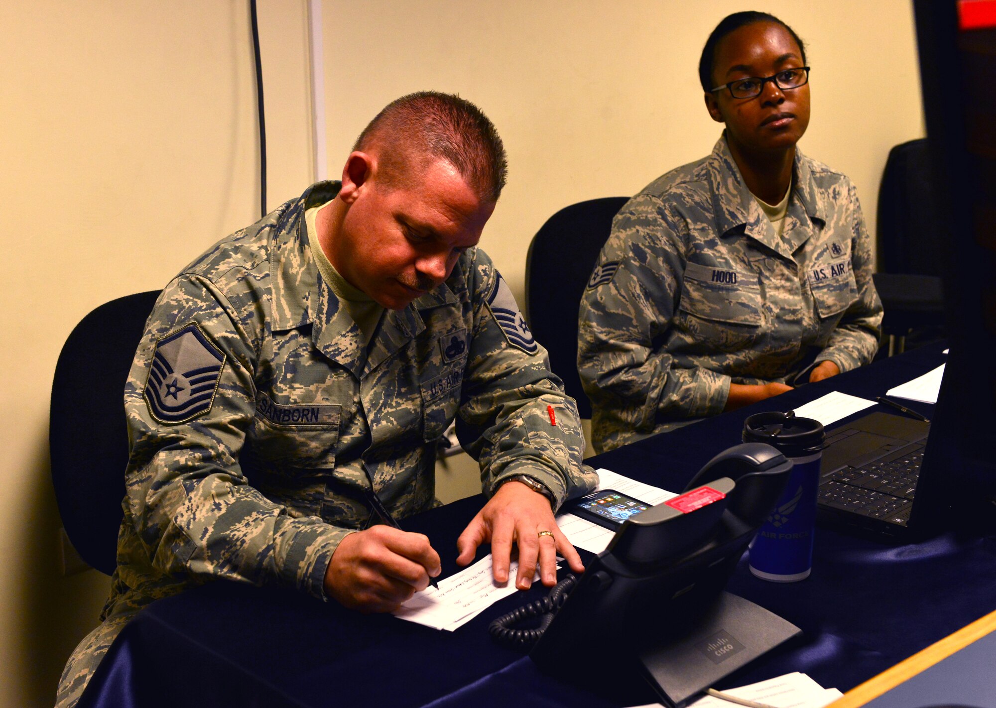 Members of the 39th Master Sgt. Richard Sanborn, 39th Civil Engineer Squadron unaccompanied housing superintendent, fills out a song request form during the 2015 Air Force Assistance Fund Telethon April 23, 2015 at Incirlik Air Base, Turkey.  The AFAF supports four affiliates, which are the Air Force Aid Society, Air Force Enlisted Village, The Lemay Foundation and the Air Force Villages Charitable Foundation. (U.S. Air Force photo by Senior Airman Michael Battles)
