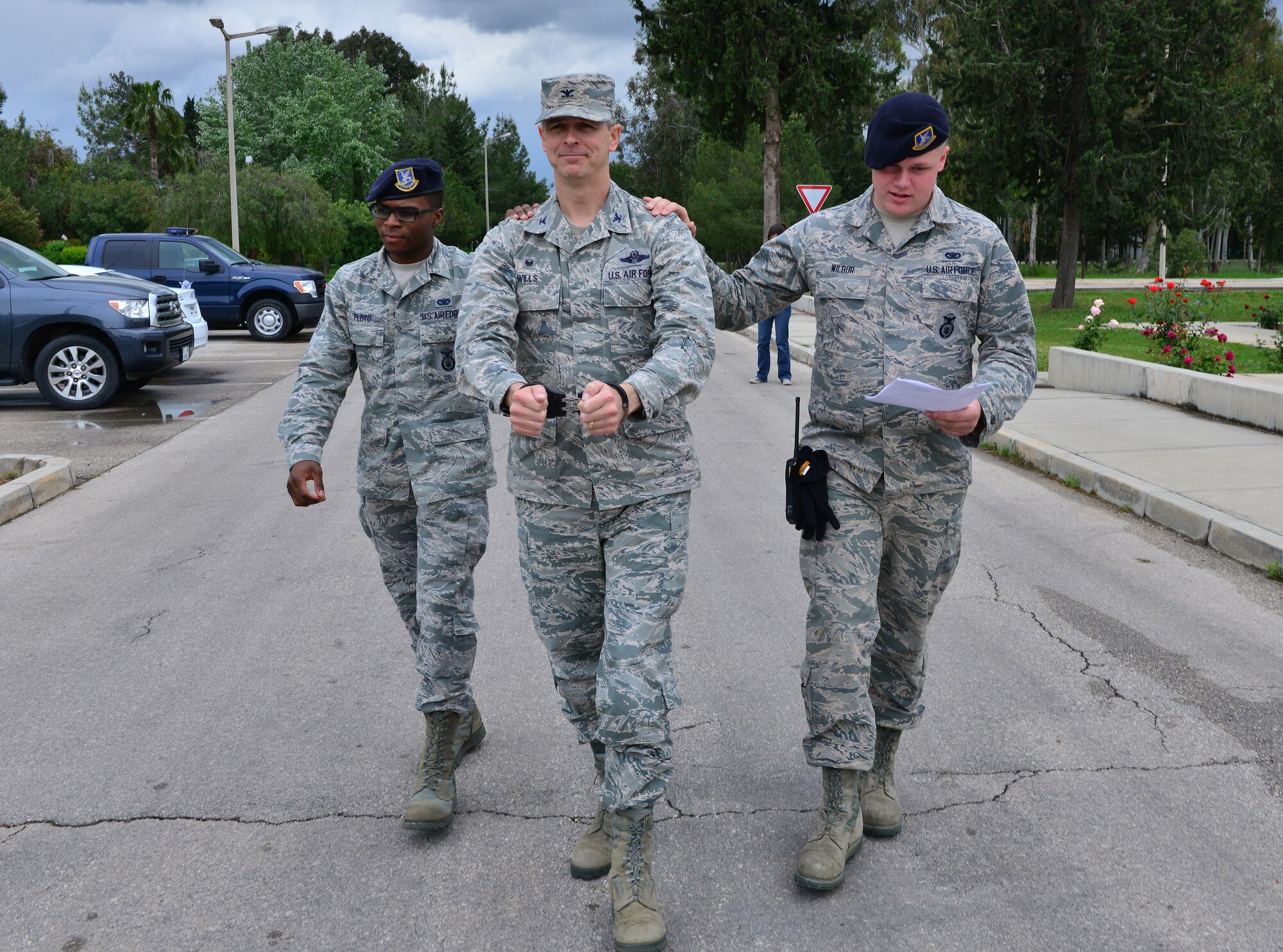 Members of the 39th Security Forces Squadron arrest Col. Craig Wills, 39th Air Base Wing commander, as part of the “jail and bail” portion of the 2015 Air Force Assistance Fund Telethon April 23, 2015, at Incirlik Air Base, Turkey. The AFAF annual campaign gives Airmen the opportunity to help their fellow Airmen, continuing the longstanding commitment to caring. (U.S. Air Force photo by Senior Airman Michael Battles/Released)