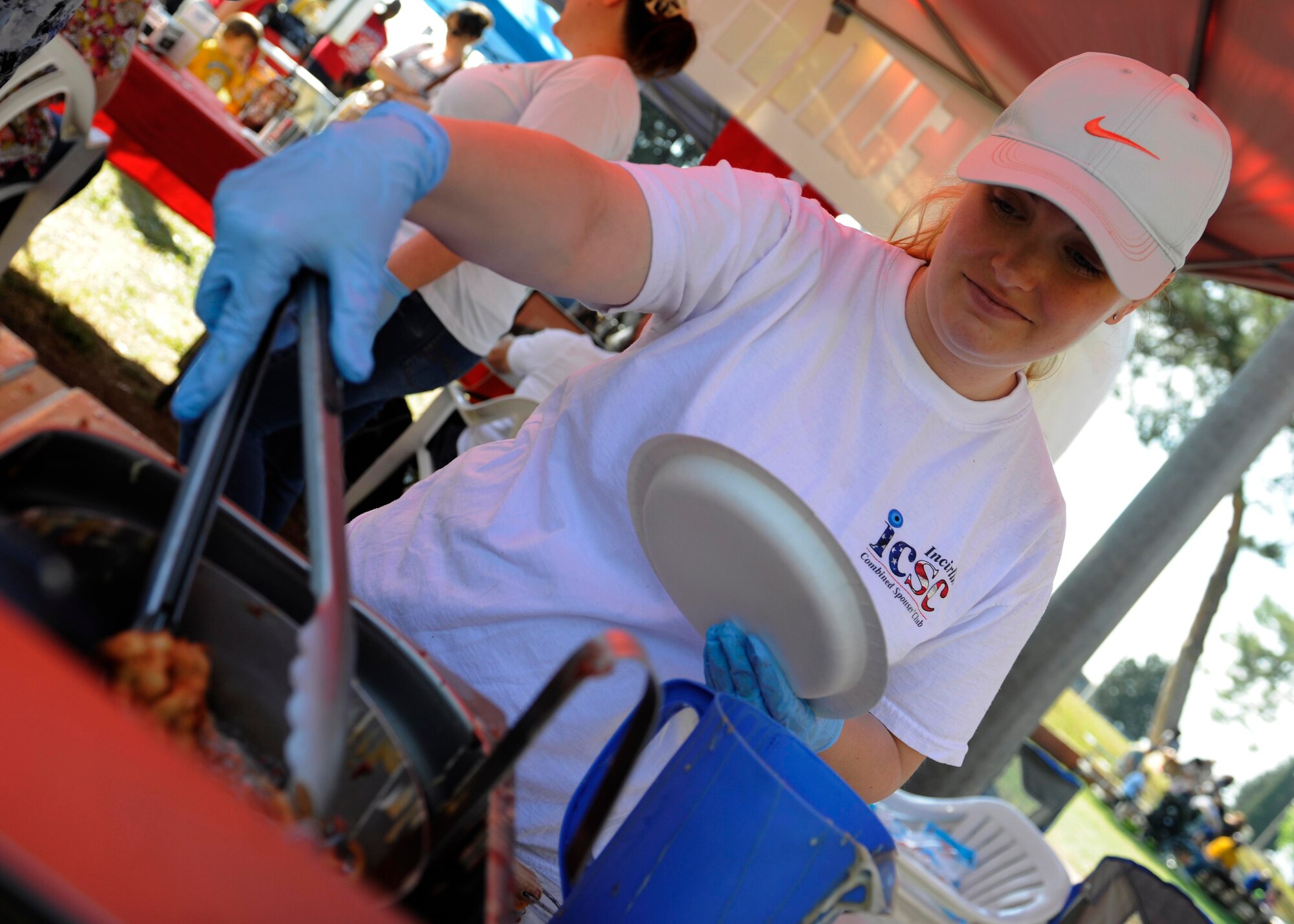 Mrs. Cortez, Incirlik Unit School teacher, fries a funnel cake during the 2015 Spring Fling April 25, 2015, at Incirlik Air Base, Turkey. Organizations from around base hosted food booths and activities, local vendors sold goods and entertainment was performed throughout this annual celebration. (U.S. Air Force photo by Senior Airman Krystal Ardrey/Released)