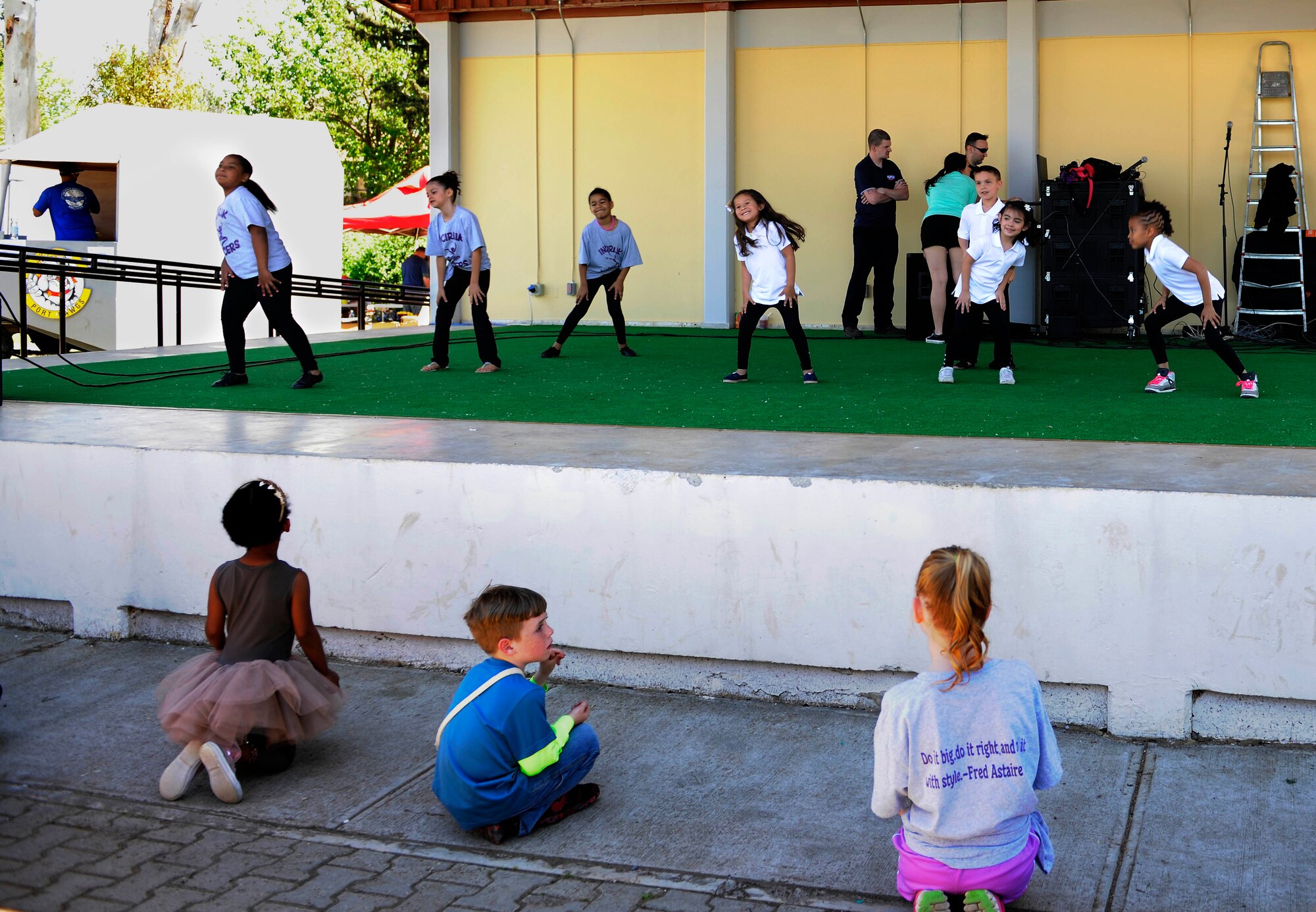 Children from dance groups on Incirlik perform at the 2015 Spring Fling April 25, 2015, at Incirlik Air Base, Turkey. The annual celebration included a variety of family oriented activities such as dance performances by local youth, face painting, bouncy castles and various arts and crafts. (U.S. Air Force photo by Senior Airman Krystal Ardrey/Released)