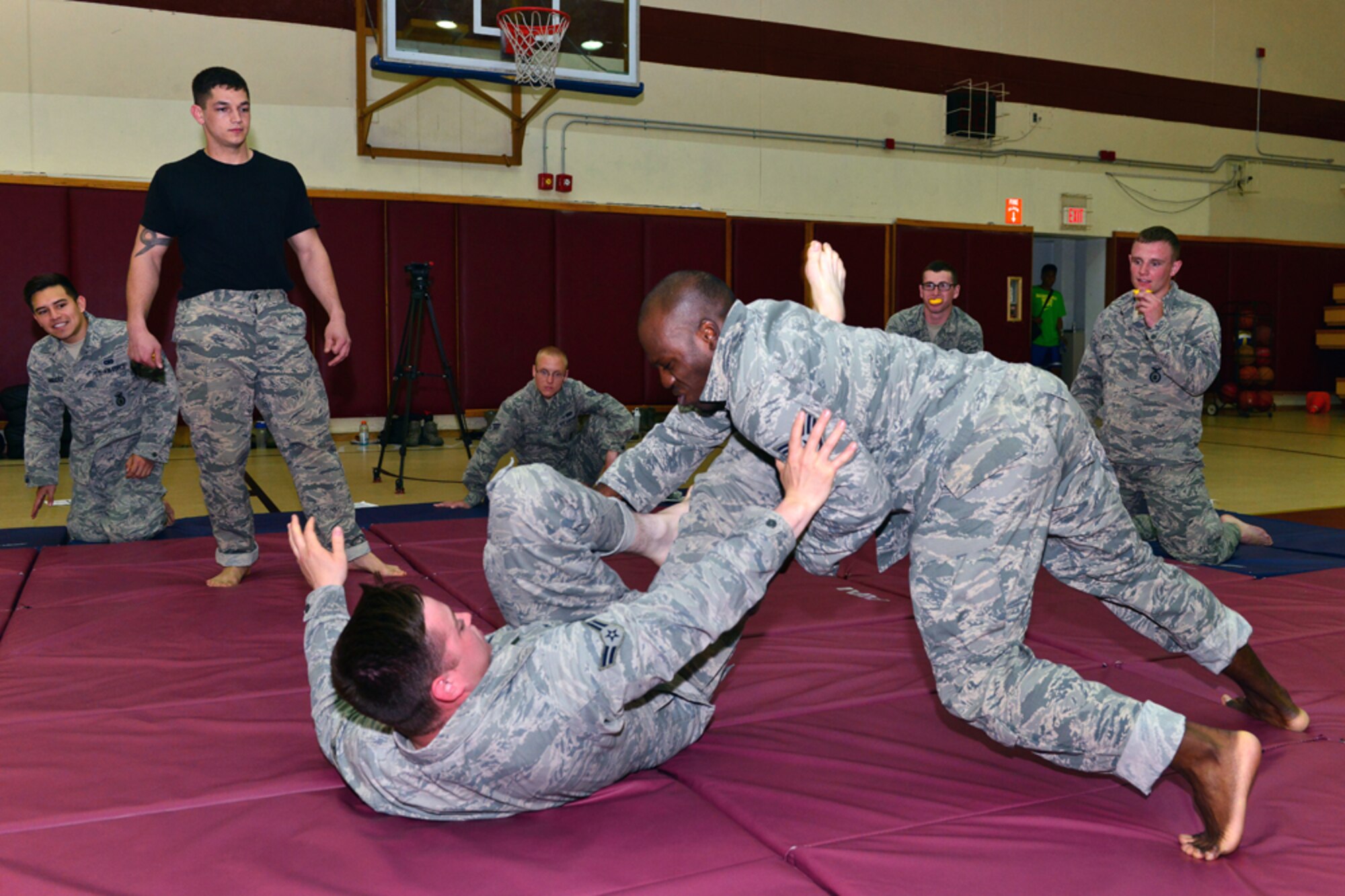 Staff Sgt. Ryan Coakley, 39th Security Forces Squadron defender, pins Airman 1st Class Zachary Johnson, 39th SFS defender, during a basic combat arms course April 20, at Incirlik Air Base, Turkey. During the five-day course Airmen from the 39th SFS learned movement techniques, evasive grappling, weapons control and suspect detainment. (U.S. Air Force by Senior Airman Michael Battles/ Released) 