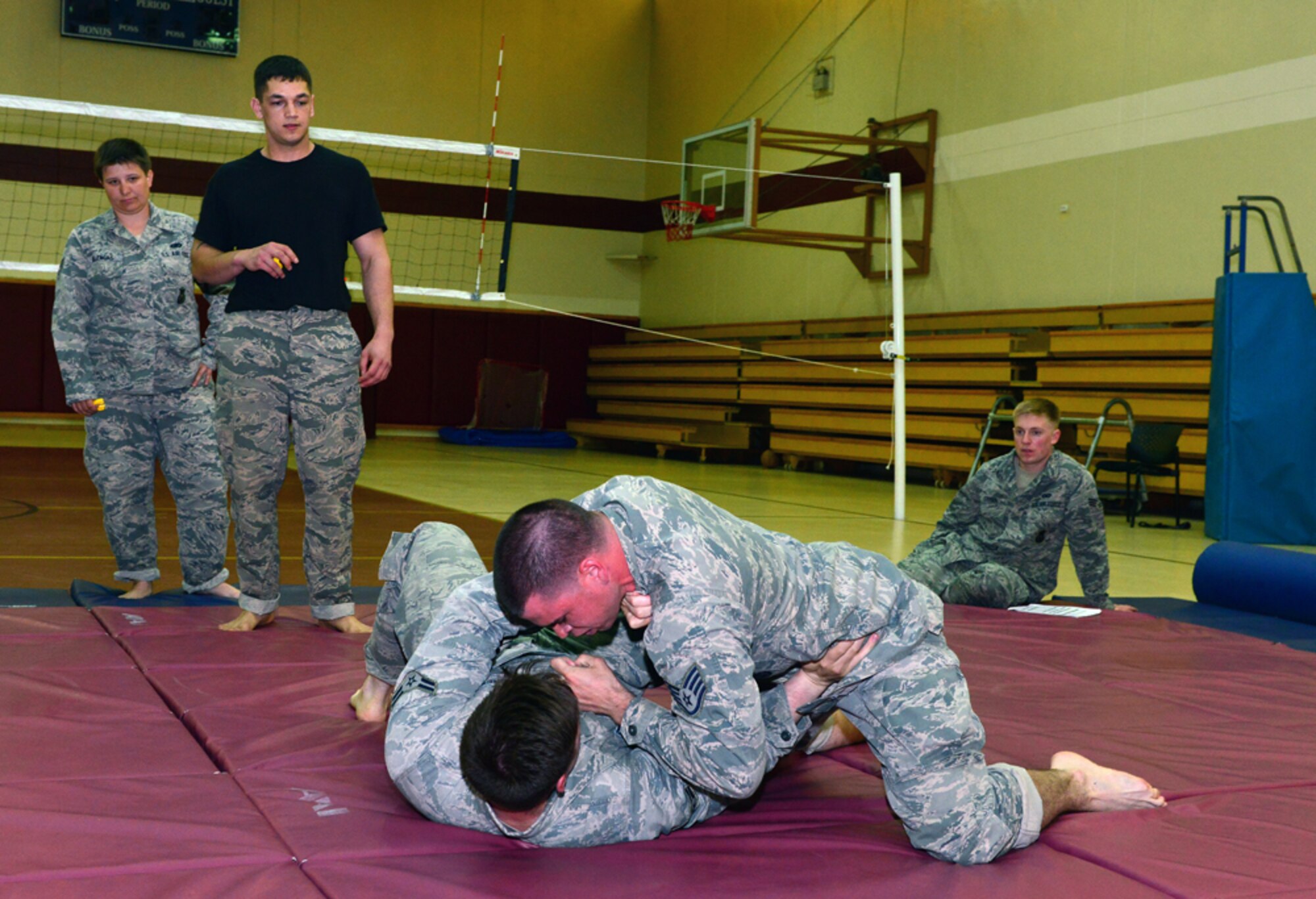Staff Sgt. Ryan Coakley, 39th Security Forces Squadron defender, pins Airman 1st Class Zachary Johnson, 39th SFS defender, during a basic combat arms course April 20, at Incirlik Air Base, Turkey. During the five-day course Airmen from the 39th SFS learned movement techniques, evasive grappling, weapons control and suspect detainment. (U.S. Air Force by Senior Airman Michael Battles/ Released) 
