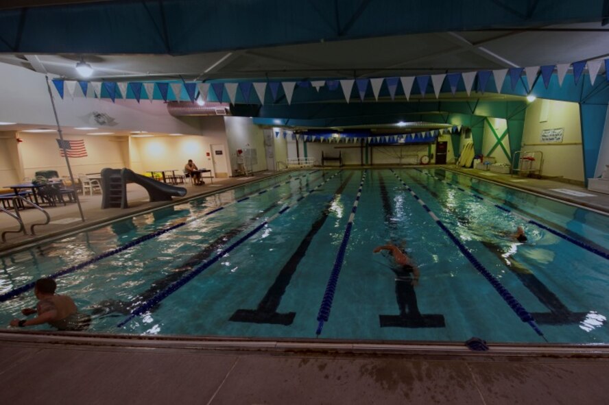 Airmen and civilians share the pool during the new expanded hours on Minot Air Force Base, N.D., April 24, 2015. The expanded hours are from 6-8 a.m. and, all Minot personnel may participate in the morning lap swim. (U.S. Air Force photo/Airman 1st Class Christian Sullivan)