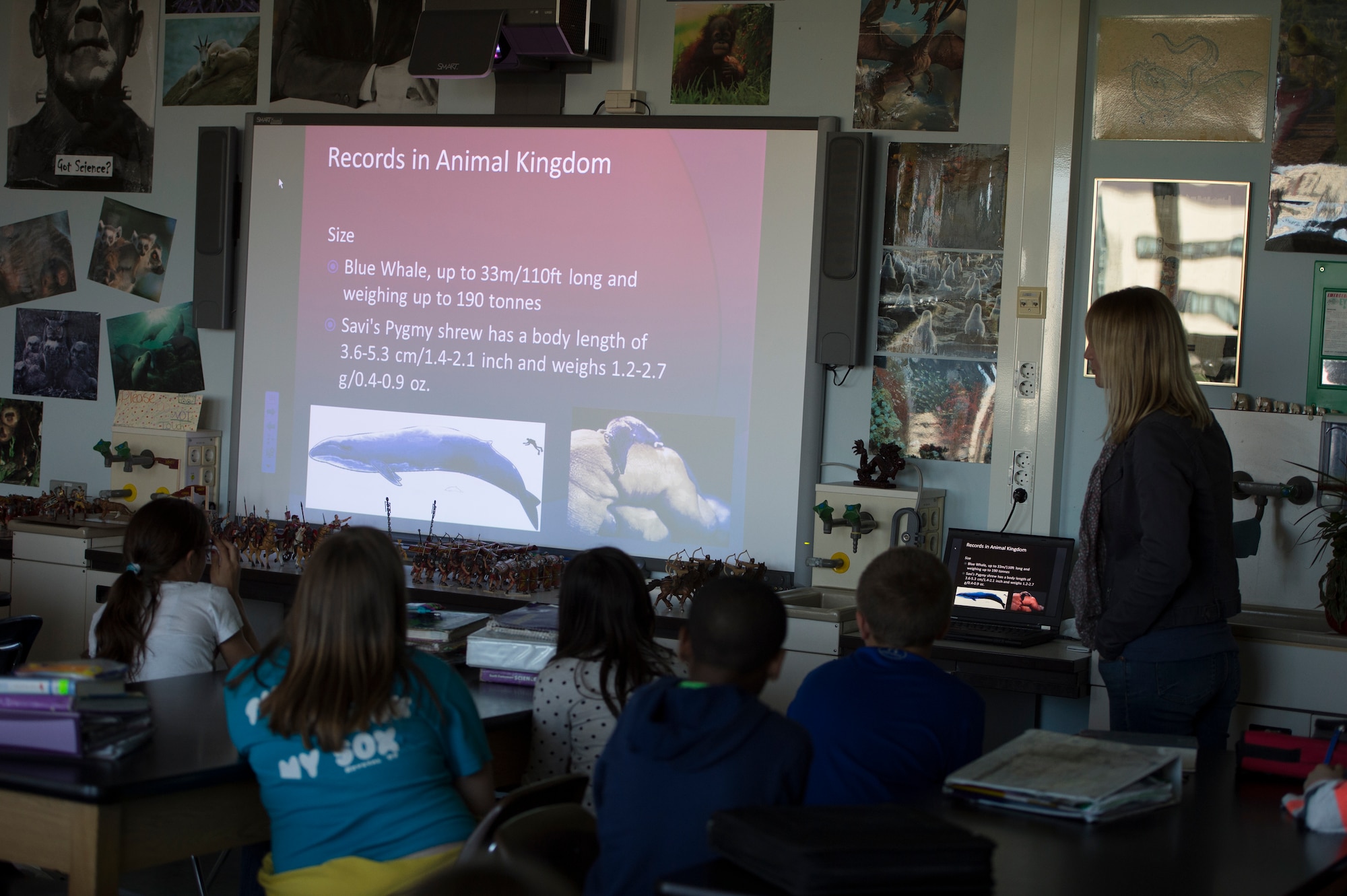 Astid Waaerius, 52nd Civil Engineer Squadron environmental engineer, gives an overview of wildlife on the planet during an Earth Day classroom presentation at Spangdahlem Middle School, April 22, 2015, on Spangdahlem Air Base, Germany. The 52nd CES environment element hosts classes twice a year. (U.S. Air force photo by Staff Sgt. Christopher Ruano/Released)