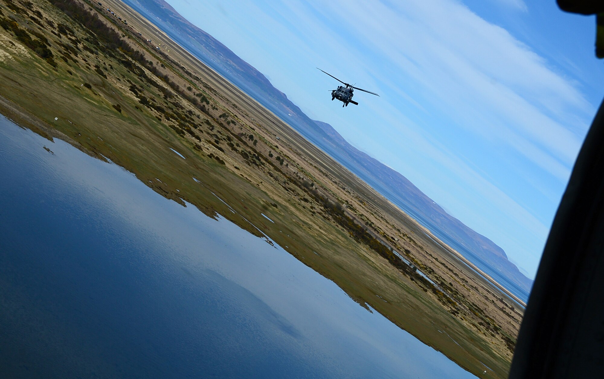 An HH-60G Pave Hawk assigned to Royal Air Force Lakenheath's 56th Rescue Squadron, flies over Scotland during exercise Joint Warrior 15-1, April 22, 2015. The training both challenged and prepared aircrew during realistic personnel recovery scenarios. (U.S. Air Force photo by Senior Airman Erin O'Shea/Released)