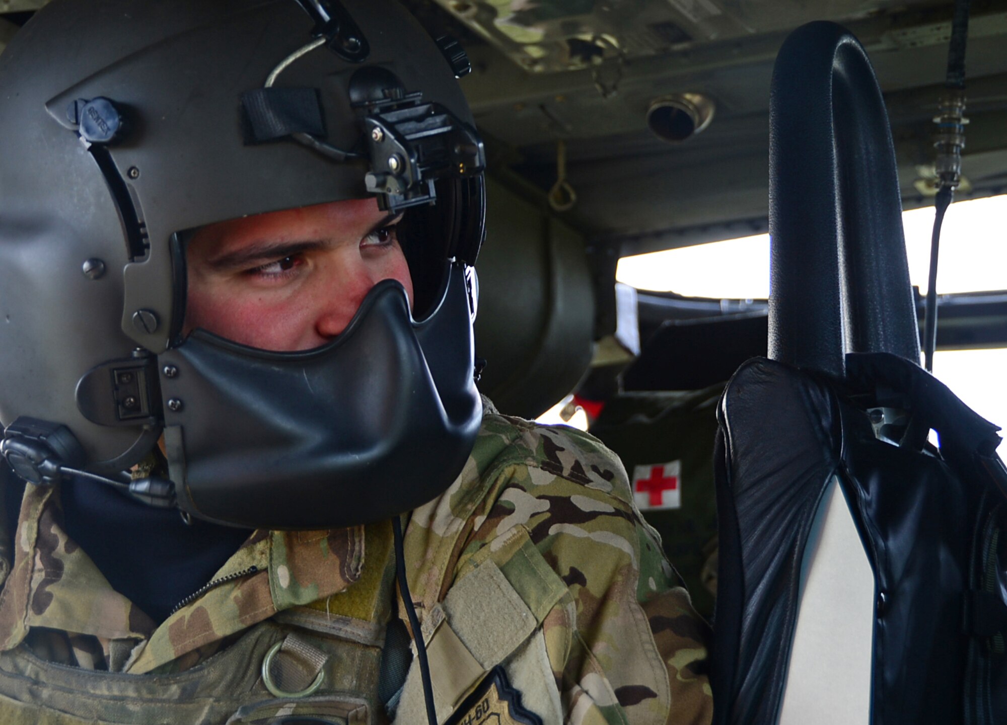 A special missions aviator assigned to Royal Air Force Lakenheath's 56th Rescue Squadron flies in an HH-60G Pave Hawk helicopter during exercise Joint Warrior 15-1 in Scotland, April 23, 2015. Three 56th RQS HH-60G Pave Hawks participated in the multinational exercise where they trained performing air-to-air combat maneuvers over both land and sea. (U.S. Air Force photo by Senior Airman Erin O'Shea/Released)