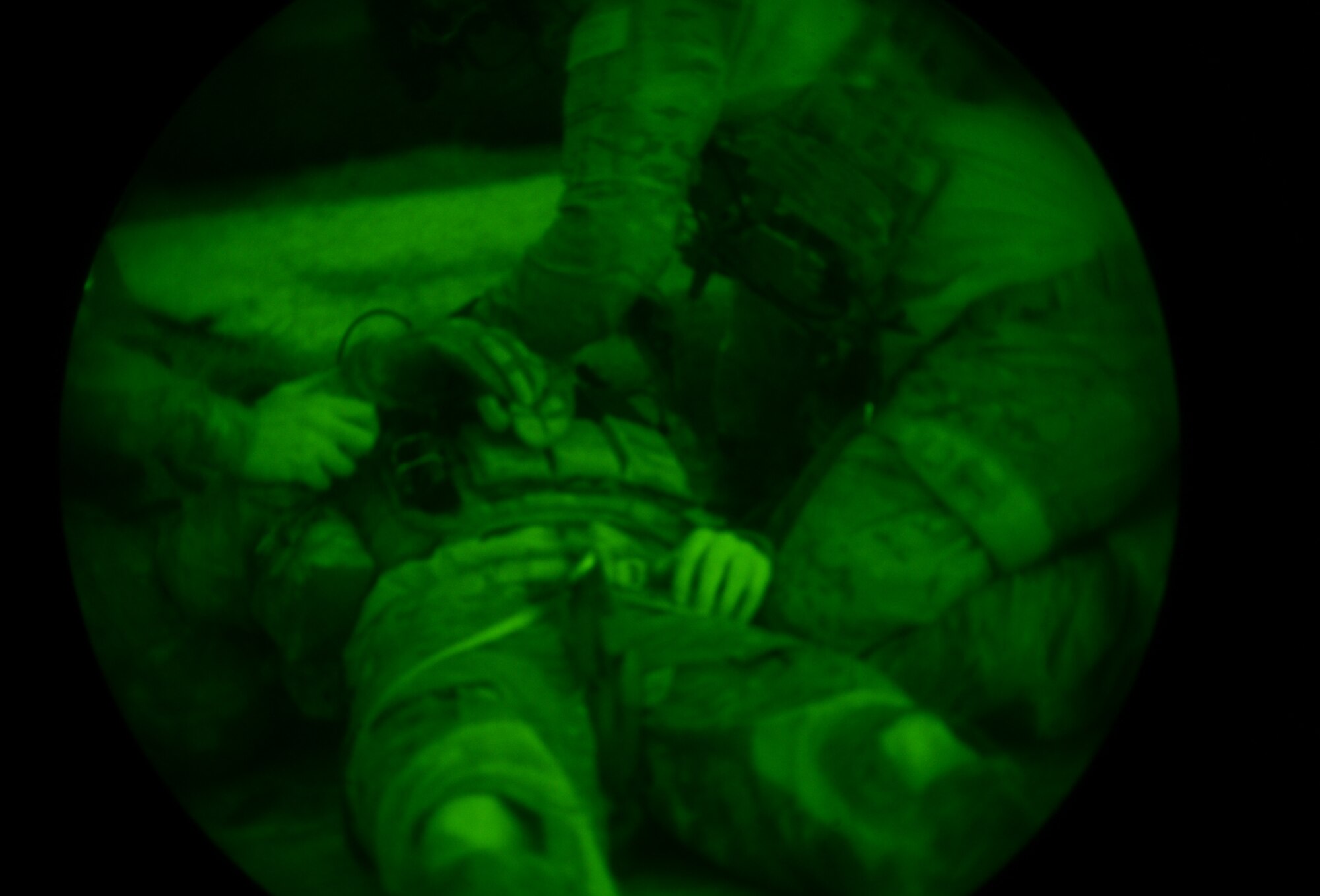 Pararescuemen assigned to Royal Air Force Lakenheath's 57th Rescue Squadron treat a team member during a training scenario at exercise Joint Warrior 15-1 in Scotland, April 22, 2015. The exercise enhanced pararescuemen readiness by replicating situations they may encounter during real-world operations. (U.S. Air Force photo by Senior Airman Erin O'Shea/Released)