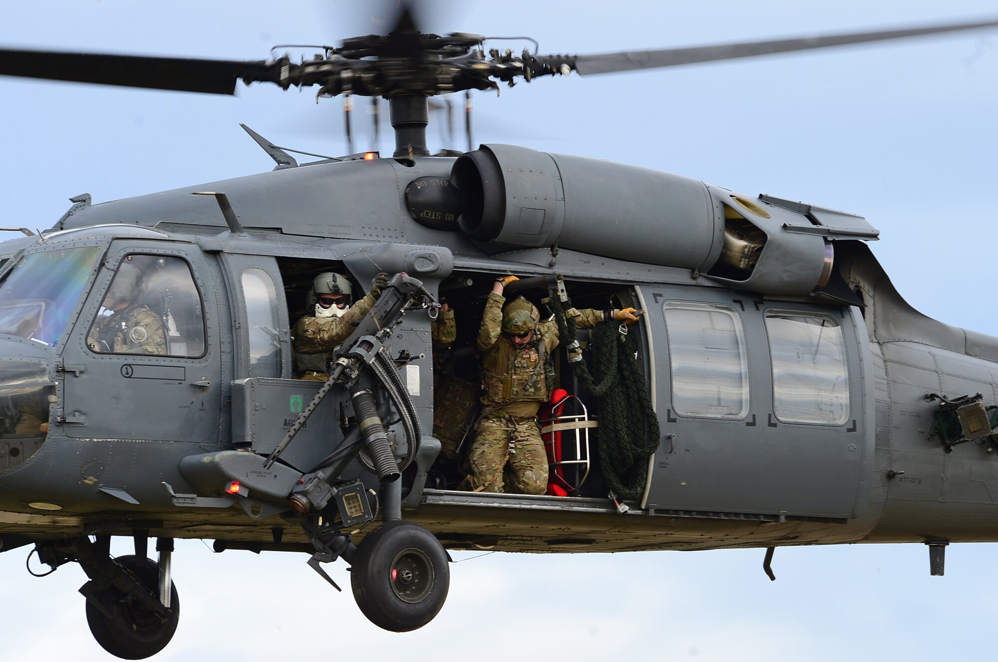 Pararescuemen assigned to Royal Air Force Lakenheath's 57th Rescue Squadron prepare to rappel from an HH-60G Pave Hawk during exercise Joint Warrior 15-1 in Scotland, April 22, 2015. The exercise tested the ability of armed forces from various countries to synchronize during worldwide operations. (U.S. Air Force photo by Senior Airman Erin O'Shea/Released)
