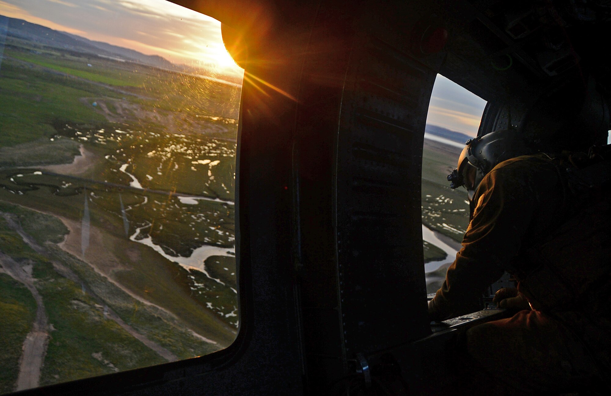A special missions aviator assigned to Royal Air Force Lakenheath's 56th Rescue Squadron flies in an HH-60G Pave Hawk helicopter during exercise Joint Warrior 15-1 in Scotland, April 22, 2015. The exercise tested the ability of armed forces from 14 countries to synchronize during worldwide operations. (U.S. Air Force photo by Senior Airman Erin O'Shea/Released)