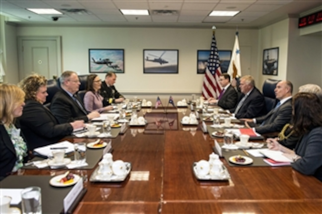 U.S. Deputy Defense Secretary Bob Work, left center, meets with Australian Assistant Defense Minister Stuart Robert, right center, to discuss matters of mutual importance at the Pentagon, April 27, 2015.