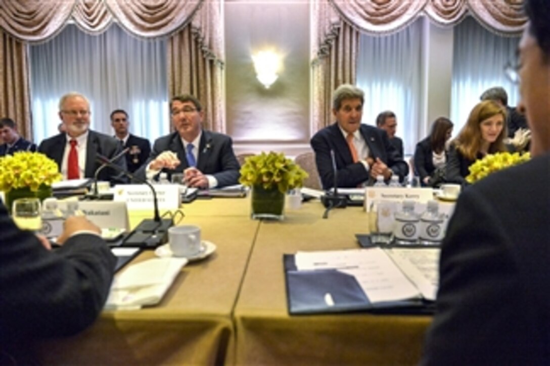 U.S. Defense Secretary Ash Carter, left center, and U.S. Secretary of State John F. Kerry meet with Japanese Defense Minister Gen Nakatani, left foreground, and Japanese Foreign Minister Fumio Kishida, right foreground, in New York City, April 27, 2015, to discuss new guidelines for U.S.-Japan defense cooperation.