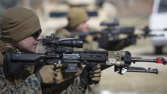 Lance Cpl. Grant R. Burch, a rifleman with Charlie Company, 1st Battalion, 24th Marine Regiment, simulates clearing a room during urban warfare training during Exercise Arctic Eagle at Camp Grayling, Michigan, April 24, 2014. Marines joined members of the Army National Guard and the Danish Home Guard at this exercise to train counterinsurgency tactics and urban warfare.