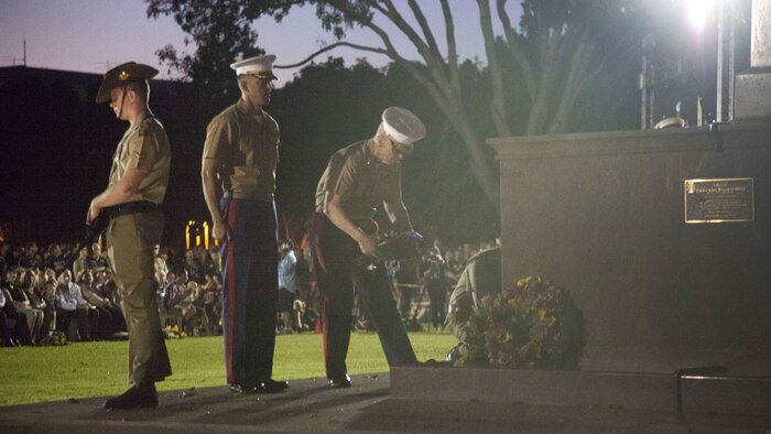 Lieutenant General John A. Toolan, right, prepares to lay a wreath down at the base of the cenotaph during the Dawn Ceremony April 25 at Darwin, Northern Territory, Australia. Toolan is visiting the Marines of Marine Rotational Force – Darwin during his trip around the Pacific. MRF-D is the deployment of U.S. Marines to Darwin and the Northern Territory, for six months at a time, where they will conduct exercises and training on a rotational basis with the Australian Defence Force. Toolan is the commander of U.S. Marine Corps Forces, Pacific. 