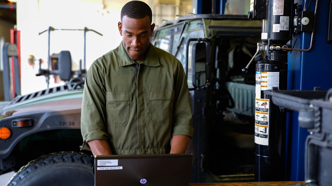Lance Cpl. Cedric Hargrove enters data into Global Combat Support System-Marine Corps using a laptop in a motor bay at The Basic School aboard Marine Corps Base Quantico, Va. Thanks to a recent GCSS-MC software update, Marines will be able to make better use of the logistics and resource management software system in limited-connectivity environments.