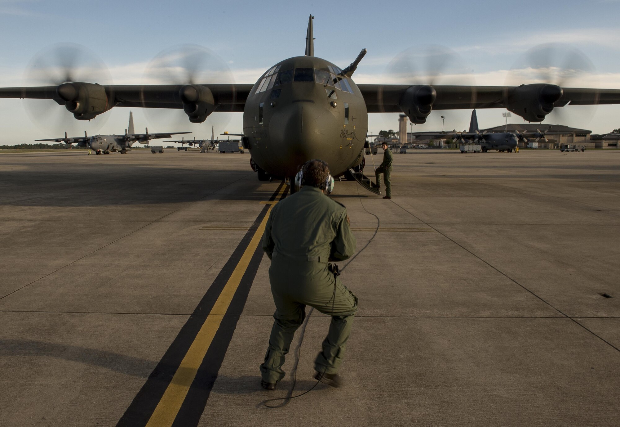 British Royal Air Force C-130J engineers conduct start up procedures before taking off in support of Emerald Warrior, Hurlburt Field, Fla., April 22, 2015. Emerald Warrior is the Department of Defense's only irregular warfare exercise, allowing joint and combined partners to train together and prepare for real world contingency operations. (U.S. Air Force photo by Staff Sgt. Matthew Bruch/Released)