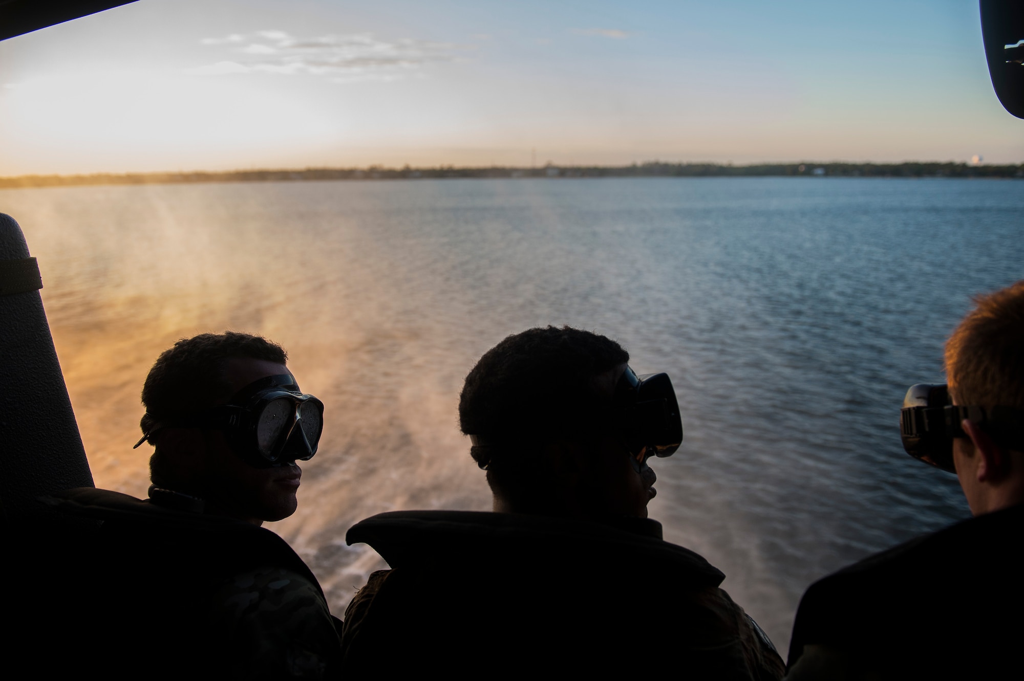 Members of the U.S. Army 7th Special Forces Group wait to jump out of a UH-60 Black Hawk during helocast training April 21, 2015, as part of Emerald Warrior at Hurlburt Field, Fla. Emerald Warrior is the Department of Defense's only irregular warfare exercise, allowing joint and combined partners to train together and prepare for real-world contingency operations. (U.S. Air Force photo by Staff Sgt. Kenneth W. Norman/Released)