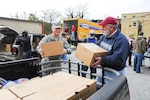 As a Partner in Care congregation, the Christ Our King Presbyterian Church in Bel Aire, Maryland, has agreed to provide support to Maryland National Guard members and their Families when they are in need. Services include counseling for individuals, couples and Families; child care; basic household and auto repairs; emergency food, clothing and housing support; crisis and grief counseling; and transportation. Photo from 2012 shows delivery of holiday tukeys and boxes to a Baltimore church.