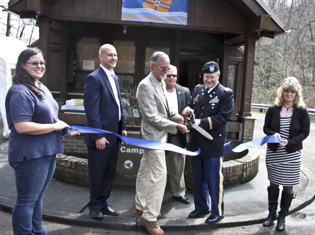 Dignitaries cut the ribbon on a new partnership at Tub Run Campground in Confluence, Pa., April 9. Cutting the ribbon was Elizabeth McCarty (left), Senator Pat Stefano, Mark McCarty, Neal Christopher, Lt. Col. Gerald Dull, and Sheila Shea. 