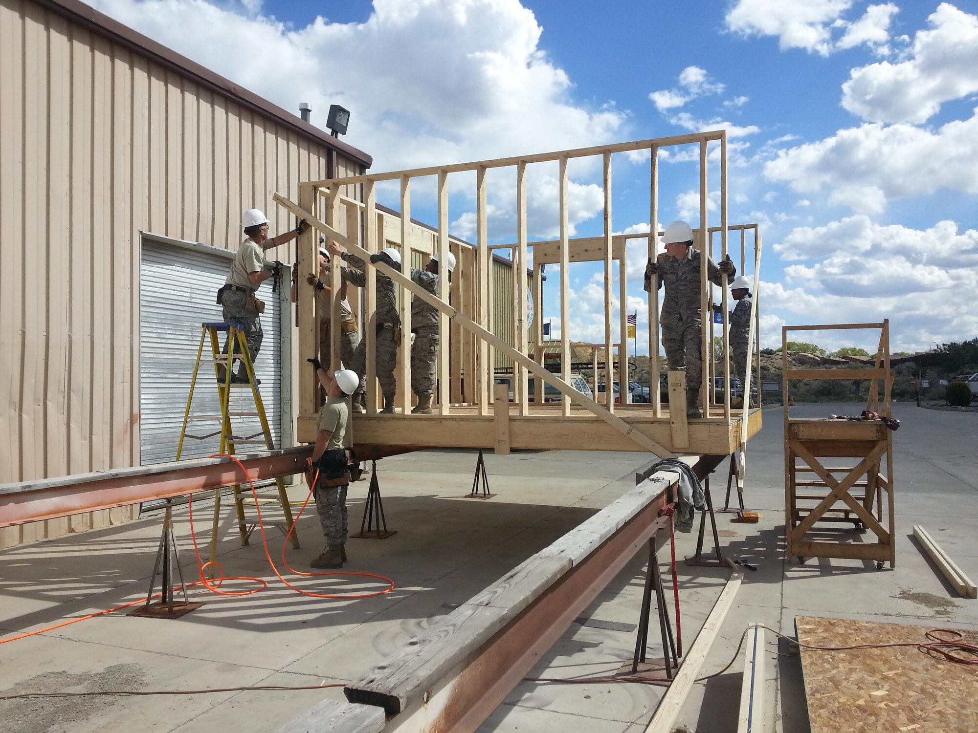 Air Force reservists from the 419th Civil Engineer Squadron at Hill Air Force Base, Utah, and the 459th CES at Andrew AFB, M.D., begin construction on a modular home in Gallup, N.M. earlier this month. During their annual tour training April 5-18, the reservists joined the Southwest Indian Foundation to provide shelter to homeless Native American families in the Four Corners area. (Courtesy photo) 
