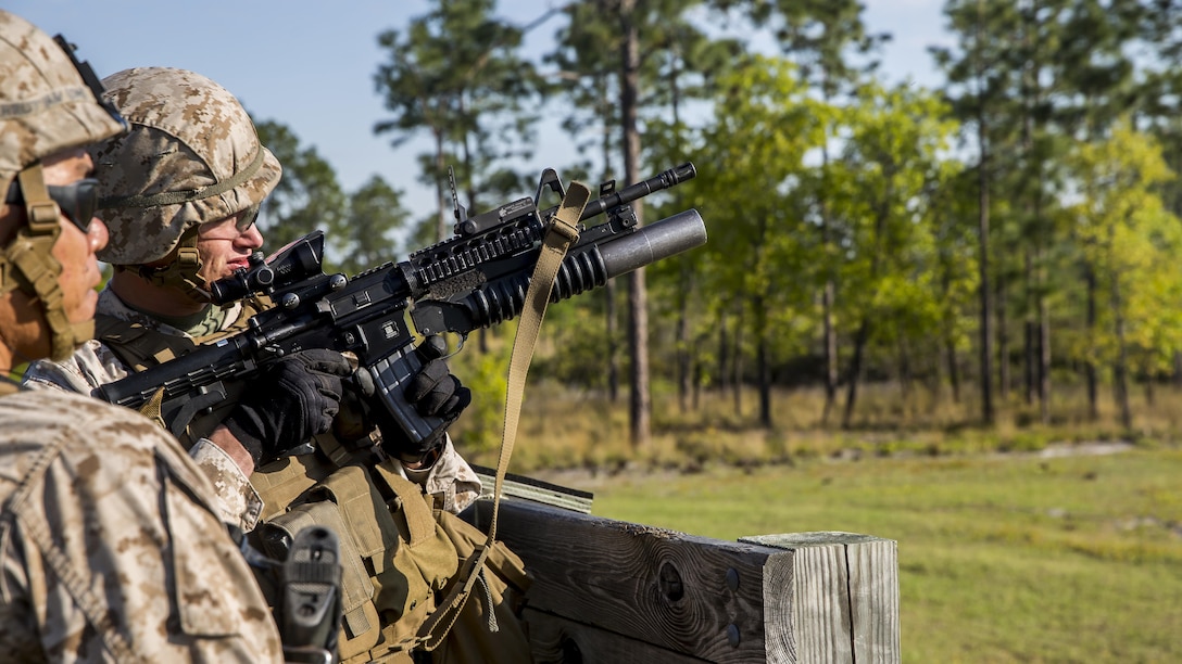 Corporal Nicholas Sullivan, a fire team leader with 2nd Combat Engineer Battalion, 2nd Marine Division, and Fayetteville, Ark., native, prepares to fire the M203 40mm grenade launcher before firing the shoulder-launched multipurpose assault weapon, or SMAW, during live-fire training aboard Camp Lejeune, N.C., April 23, 2015. “This was [our] live-fire to demonstrate proficiency with those weapons systems [which] we will be using in more advanced training and through our deployment,” said 2nd Lt. Andrew Horgan, a platoon commander with 2nd CEB and Delmar, N.Y., native.