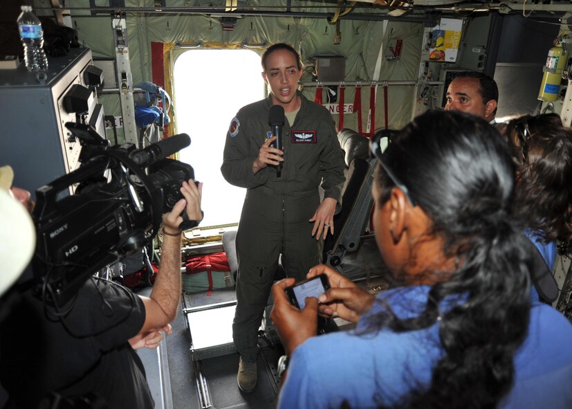 Maj. Eileen Bundy, 53rd Weather Reconnaissance Squadron aerial reconnaissance weather officer, answers the media’s questions during a tour of the WC-130J at the Flamingo Airport, Bonaire, April 22, 2015, during the Caribbean Hurricane Awareness Tour. More than 1,500 community leaders, students and locals toured the WC-130J, which was on display as part of the CHAT. The outreach program, which began in the 1970's and is a joint effort between National Oceanic and Atmospheric Administration's National Hurricane Center and the 403rd Wing's 53rd Weather Reconnaissance Squadron, promotes hurricane awareness and preparedness throughout the Caribbean region. (U.S. Air Force photo/Maj. Marnee A.C. Losurdo)
